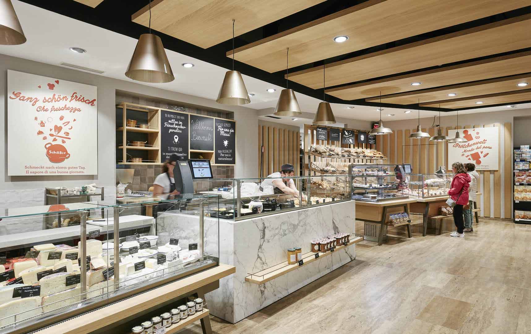A view of the fresh food counter with a large selection of meat and cheese