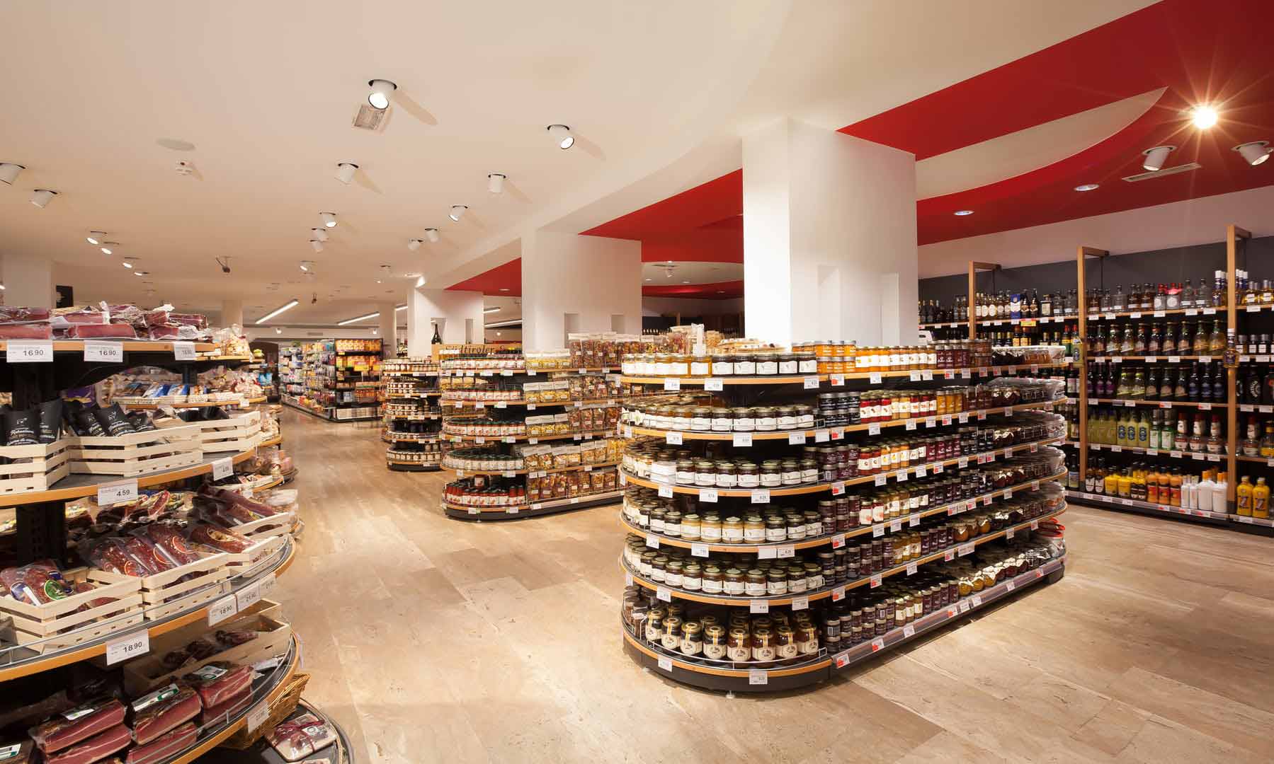 Shelves stocked with authentic South Tyrolean specialties such as speck and traditional crispbread